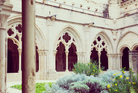 Stone galleries of inner court of Poblet Monastery at day in Spainの写真素材