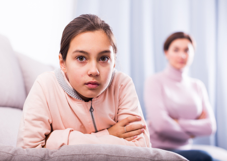 Young mother and daughter take offense at each other because of quarrelの写真素材