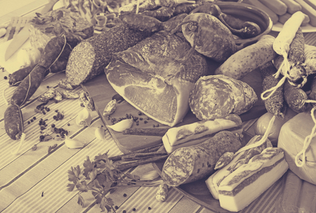 Display of mince, sausages and meat with spices on tableの写真素材