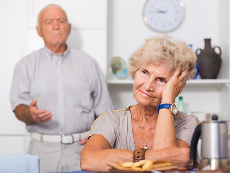 Elderly upset woman sitting separately having problems in relationship with husband
の写真素材