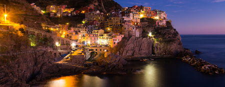 The colorful houses of Manarola, La Spezia in evening from sea view  at Italyの写真素材