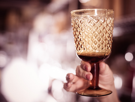 hand with crystal glass for wine collection in the dishes shopの写真素材