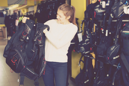 Sporty female is choosing new equipment for diving in the store
の写真素材