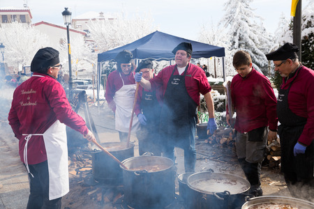 CASTELLTERCOL, SPAIN - FEBRUARY 13, 2018: Preparation of traditional Catalan soup Escudella on tuesday of Carnival on main squareのeditorial素材
