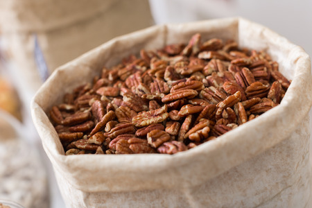Image of dark pecan in container in the store.の写真素材