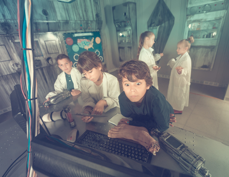 concentrated schoolkids solve task in the bunker quest roomの写真素材