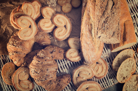 Image of various kinds of bread and  bakery products on table の写真素材