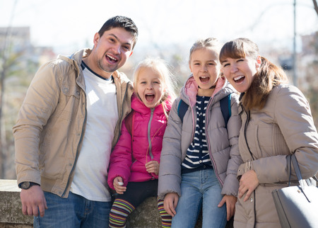 Happy family with two little daughters smiling outdoors in spring day
の写真素材