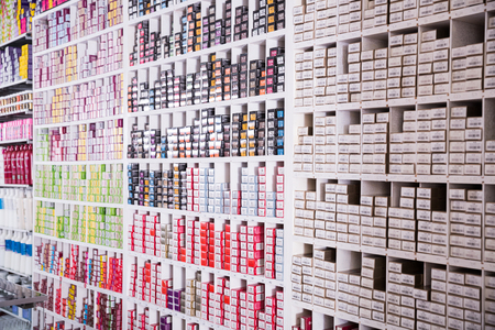 BARCELONA, SPAIN - MARCH 22, 2018: Shelves with hair dye products in a cosmetics store indoorのeditorial素材