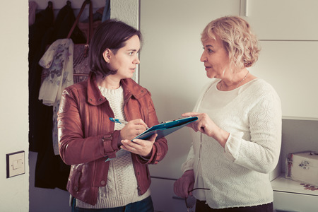 Woman participates in a social inquiry, the interviewer came home to a mature womanの写真素材