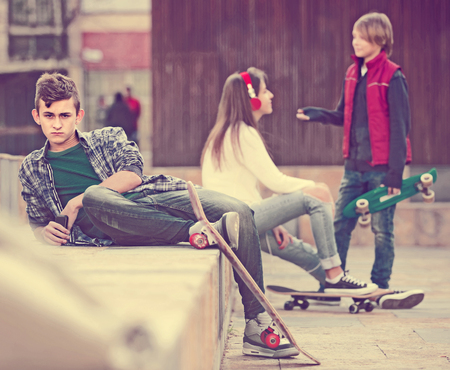 Jealous russian teen and his friends after conflict outdoors の写真素材