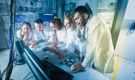 Five positive american adults solving conundrums together in quest room in view as abandoned lab