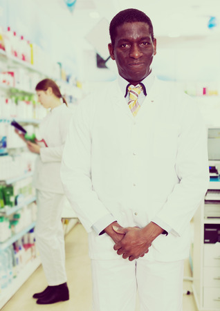Portrait of African American man pharmacist in modern pharmacyの写真素材