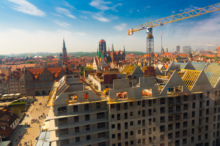 GDANSK, POLAND - MAY 12, 2018: Aerial view of Gdansk cityscape with building crane working on...