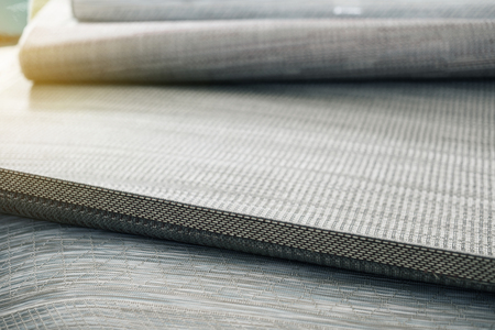 Image of wattled organic bamboo rugs at interior shop, no peopleの写真素材
