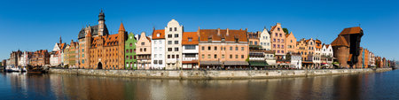 Panoramic view of Motlawa river embankment in Gdansk in sunny spring day, Poland