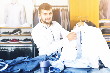 customer choice  man shirt in the boutiqueの写真素材