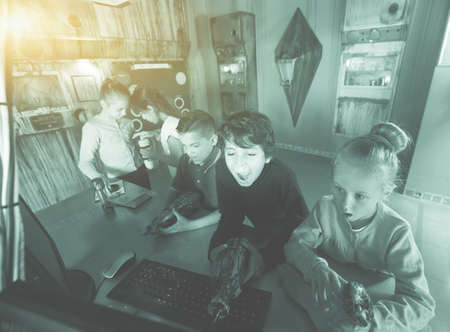 five children playing in bunker quest roomの写真素材