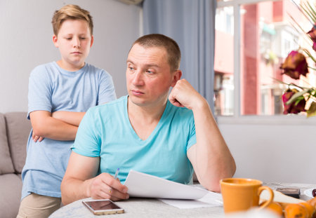 Guy and his father are conflicting and do not speak to each other at the home.