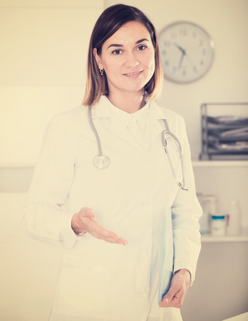 Female doctor having a productive day helping in her officeの写真素材