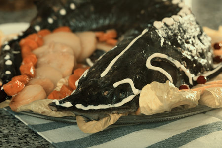 Dish of fried sturgeon with a vegetable servit at table