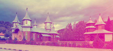 Wooden church of Saints Peter and Paul in romanian village Carlibabaの写真素材