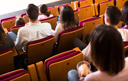 Group of people expecting for beginning of movie in cinema houseの写真素材