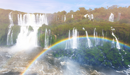 Rainbow over waters of Cataratas del Iguazu Falls, Iguazu National Park, Parana, Brazilの写真素材