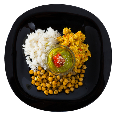 Delicious dish of chickpeas and rice with red and green sauces. Isolated over white backgroundの写真素材