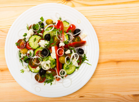 Image of Shopska salad in plate on the table indoor.の写真素材