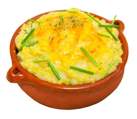 Bowl of rumbledethumps, traditional Scottish dish with potato, cabbage and onion. Isolated over white backgroundの写真素材
