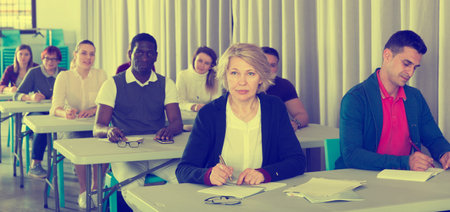 Multinational group of different age students at extension courses
