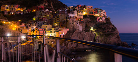 The colorful houses of Manarola, La Spezia in evening from sea view  at Italy