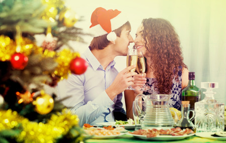 Christmas dinner at home cheerful young familyの写真素材
