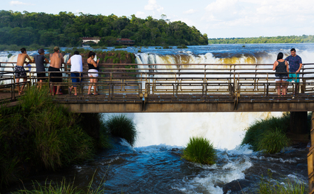 IGUAZU, ARGENTINA â FEBRUARY 16, 2017:  Numerous visitors of the park taking in marvelous view of the Iguazu Falls. Iguazu, Argentinaのeditorial素材