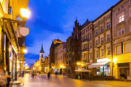 Nightlife of lighted Torun streets in warm spring, Poland