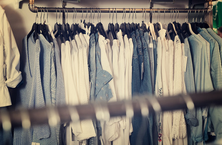 Different assortment of colorful clothing in the modern boutiqueの写真素材