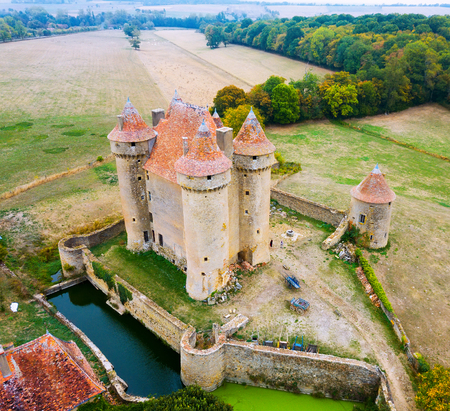 View of gorgeous medieval castle Chateau Sarzay in village of Sarzay, Franceの写真素材