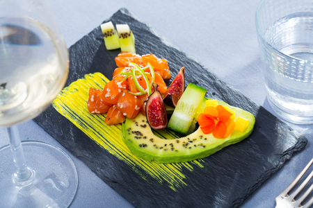 Raw tuna tartare served with avocado and spicy mango sauceの写真素材