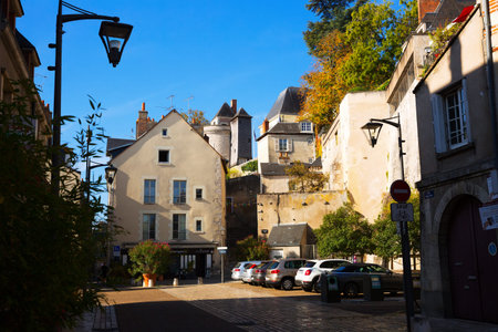 BLOIS, FRANCE - OCTOBER 09, 2018: Medieval old houses with parked cars on street of Blois city,...