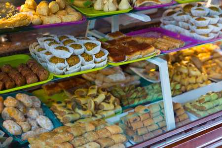 Variety of oriental sweets and bakery products on counterの写真素材
