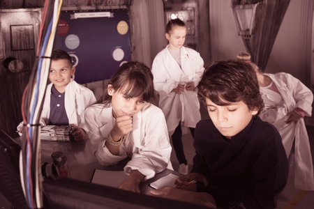 young players enthusiastically solve riddles in the quest room bunker