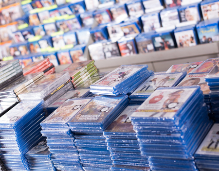BARCELONA, SPAIN - FEBRUARY 15, 2018: CD and DVD store offering huge selection of movies stacked on pilesのeditorial素材