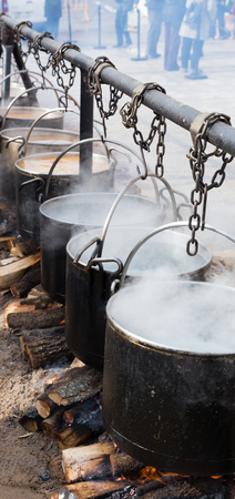 Preparation of food in boilers on an open fire in a traditional style, Spainの写真素材