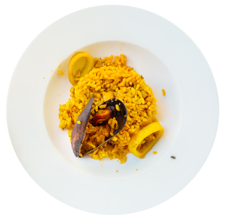 Appetizing seafood dish Paella a la marinera (Fisherman Paella) with squid rings. Isolated over white backgroundの写真素材