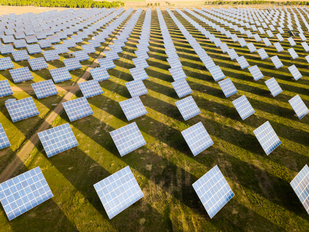 Photovoltaic solar panels at field, aerial photoの写真素材