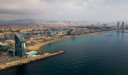 BARCELONA, SPAIN - July 29, 2018: Aerial view of cityscape with hotel W Barcelona on Barceloneta Beach in summerのeditorial素材