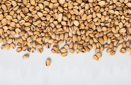 Close up of pistachios on white backgroundの写真素材