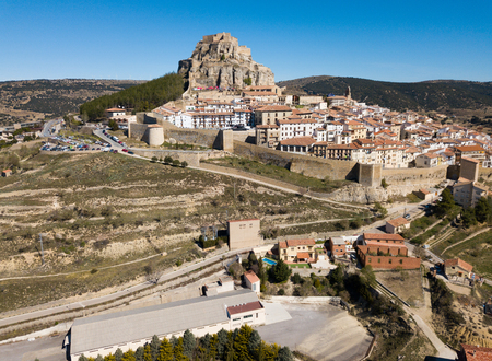 Picturesque aerial view of walled city Morella with medieval Castle on rocky hilltop, Castellon, Spainのeditorial素材