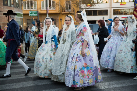 VALENCIA, SPAIN - MARCH 18, 2019: Holiday procession in national dressed during Falles (Fallas) celebration in Valenciaのeditorial素材